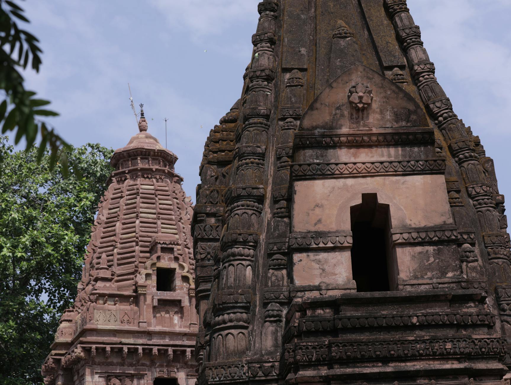 Close-up view of intricate stone carvings and architectural details on ancient temple wall