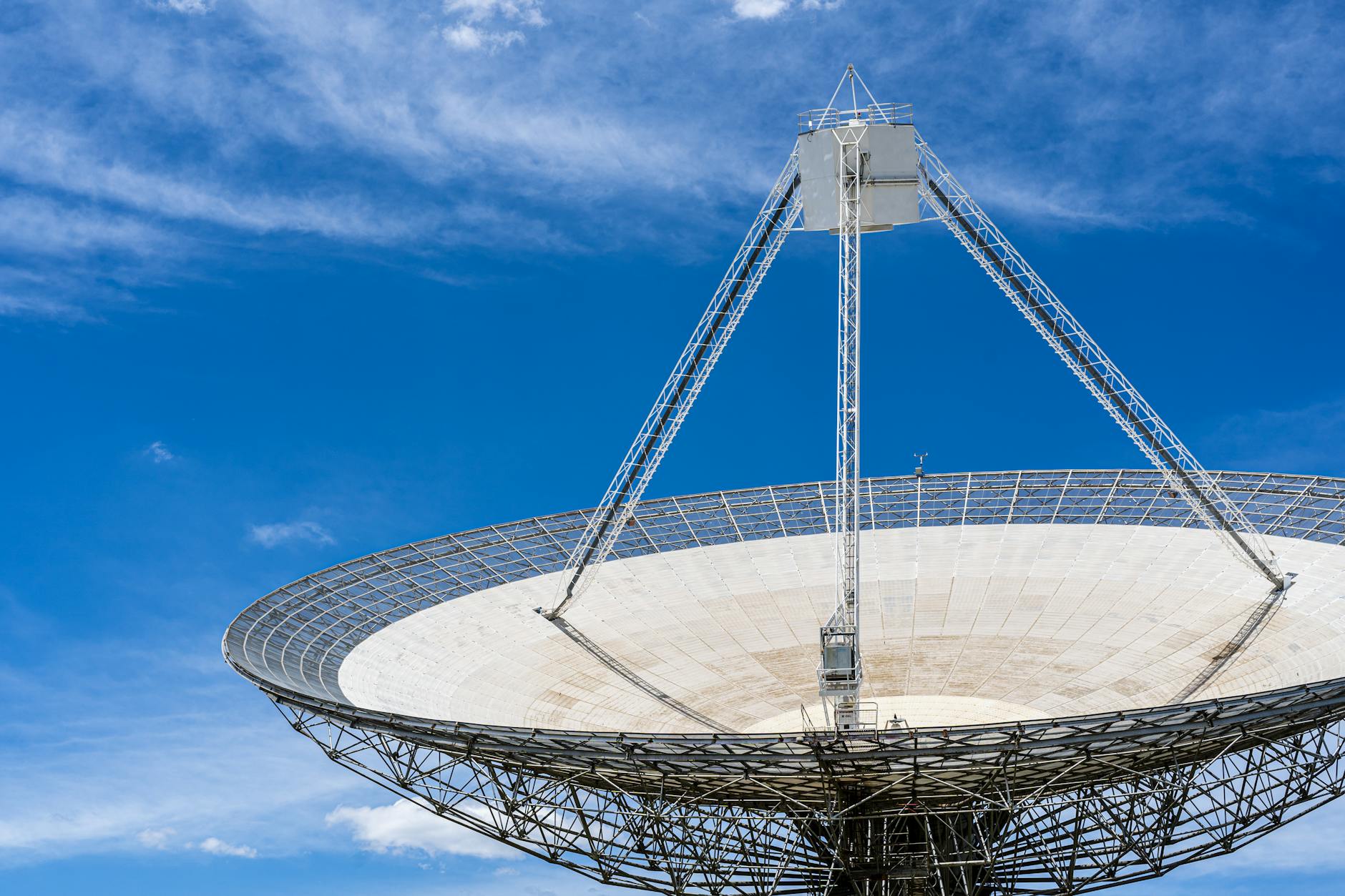 Handheld satellite communication device on wooden surface for emergency backup communication