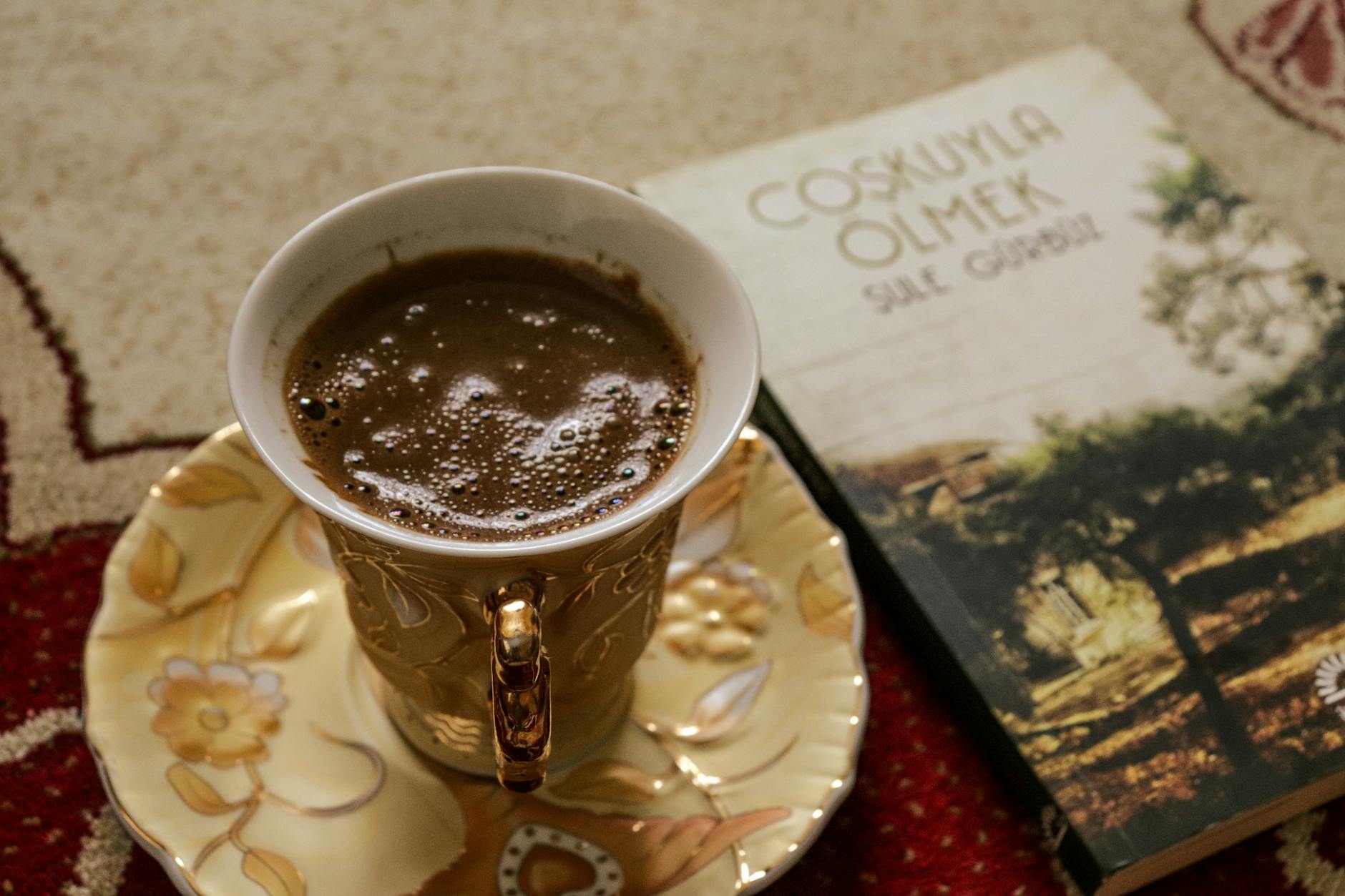 Close-up of someone taking notes in a journal during what appears to be a coaching session