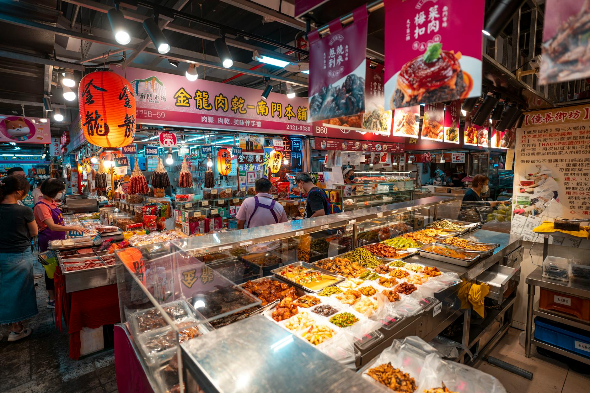 Bustling food market with vendors displaying fresh ingredients and prepared dishes