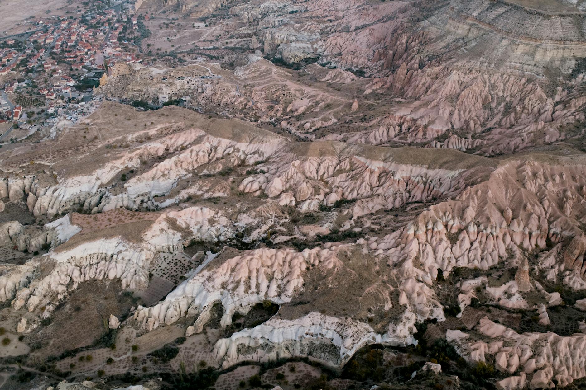 Aerial view of Cappadocia's distinctive fairy chimney rock formations and valleys