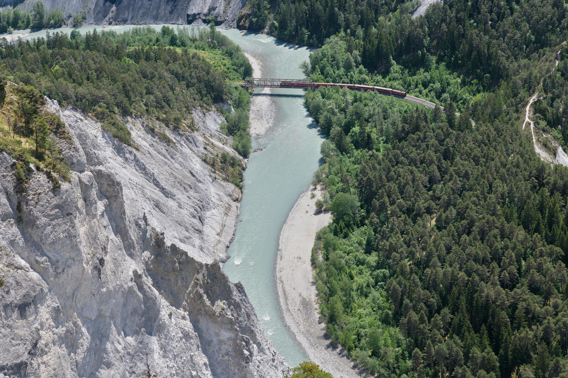 Train traveling through scenic European countryside landscape