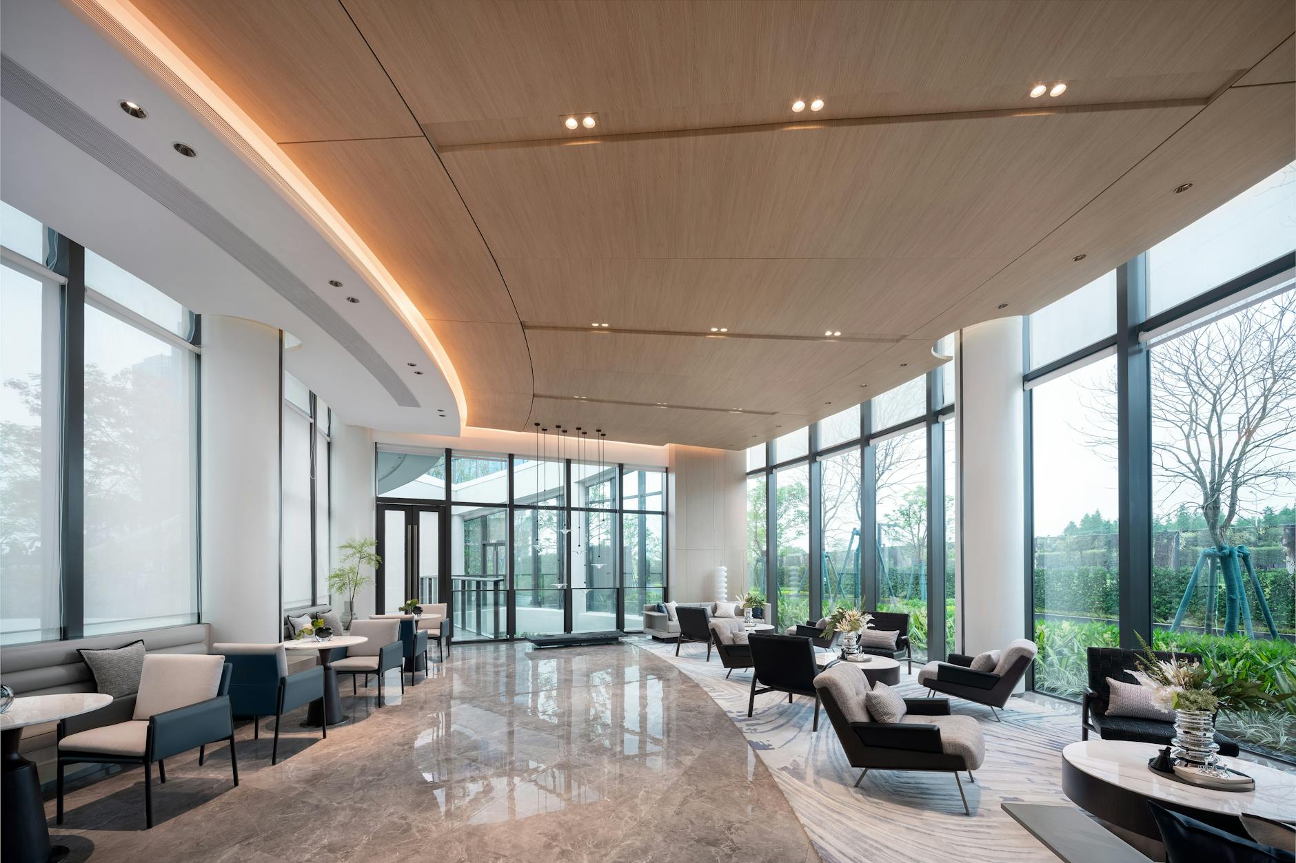 Upscale airport or hotel lounge area with comfortable seating for elite status members