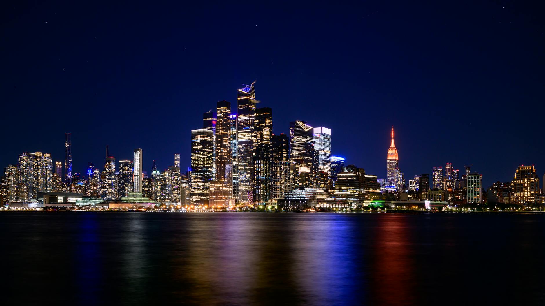 Urban city skyline at dusk showing downtown hotels and business district