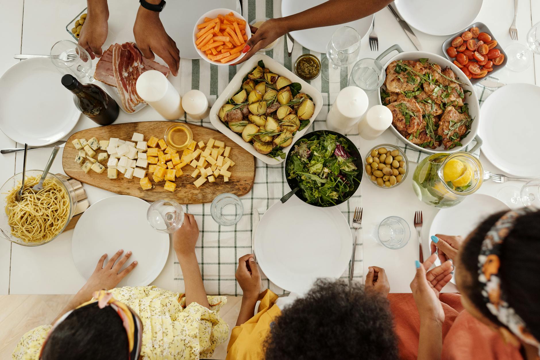 Large family of different generations sharing a meal together at a restaurant table during their vacation