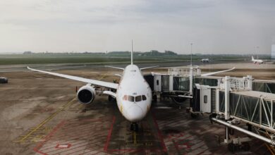 Passengers boarding commercial aircraft with carry-on luggage