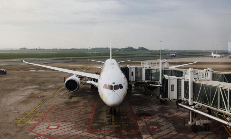 Passengers boarding commercial aircraft with carry-on luggage