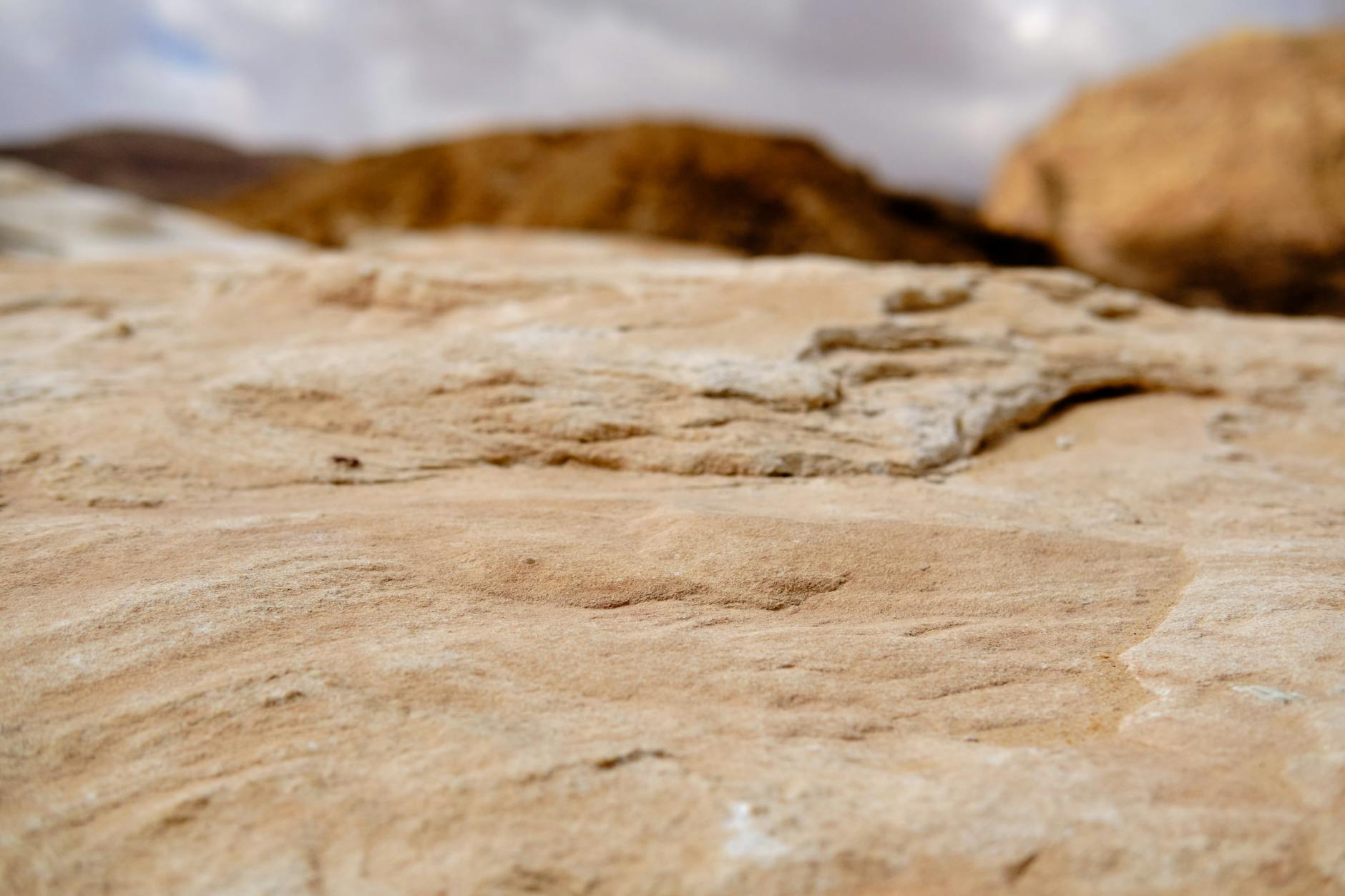 Tall sandstone rock formations rising from the red desert floor of Wadi Rum, Jordan