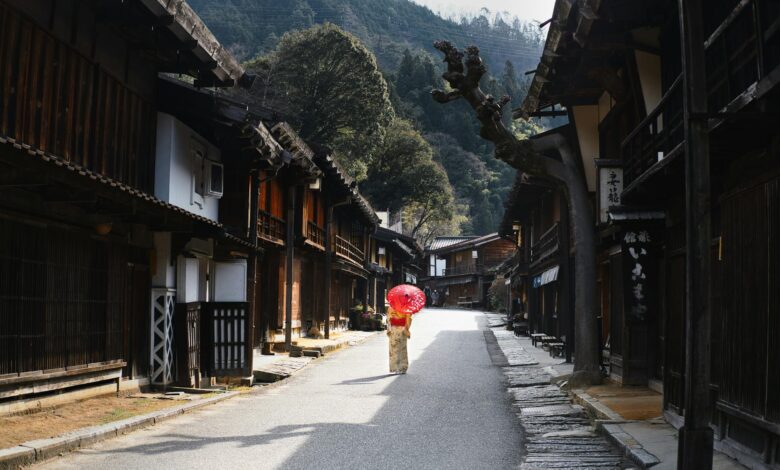 Traditional Japanese village with wooden houses and rural mountain landscape