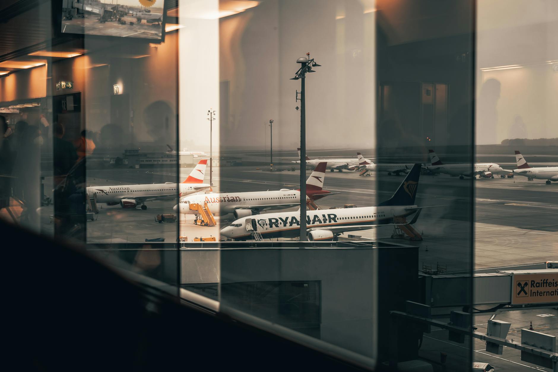 Airport departure gate with seating area and boarding announcements