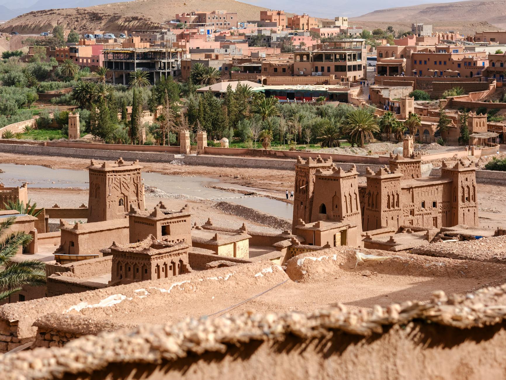 An ancient mud-brick kasbah fortress in the Moroccan desert at golden hour