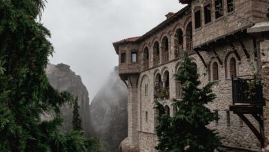 Ancient monasteries perched on tall sandstone rock pillars at Meteora, Greece