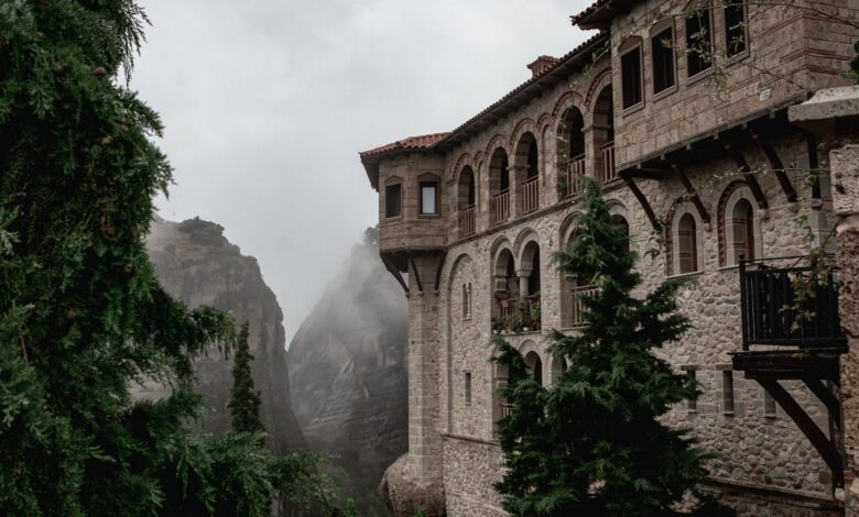 Ancient monasteries perched on tall sandstone rock pillars at Meteora, Greece