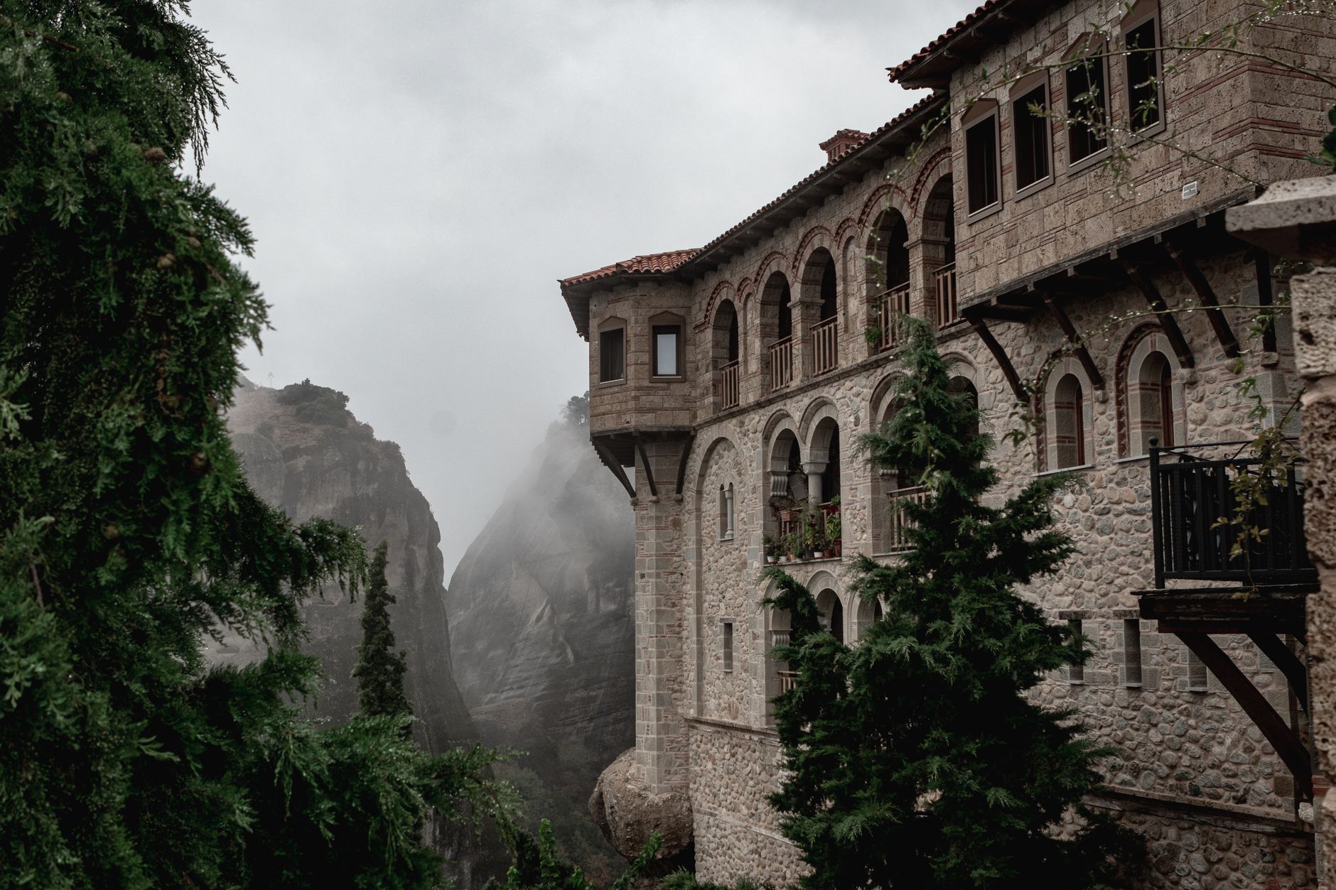 Ancient monasteries perched on tall sandstone rock pillars at Meteora, Greece