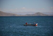 Deep blue waters of Lake Titicaca under a clear sky at high altitude