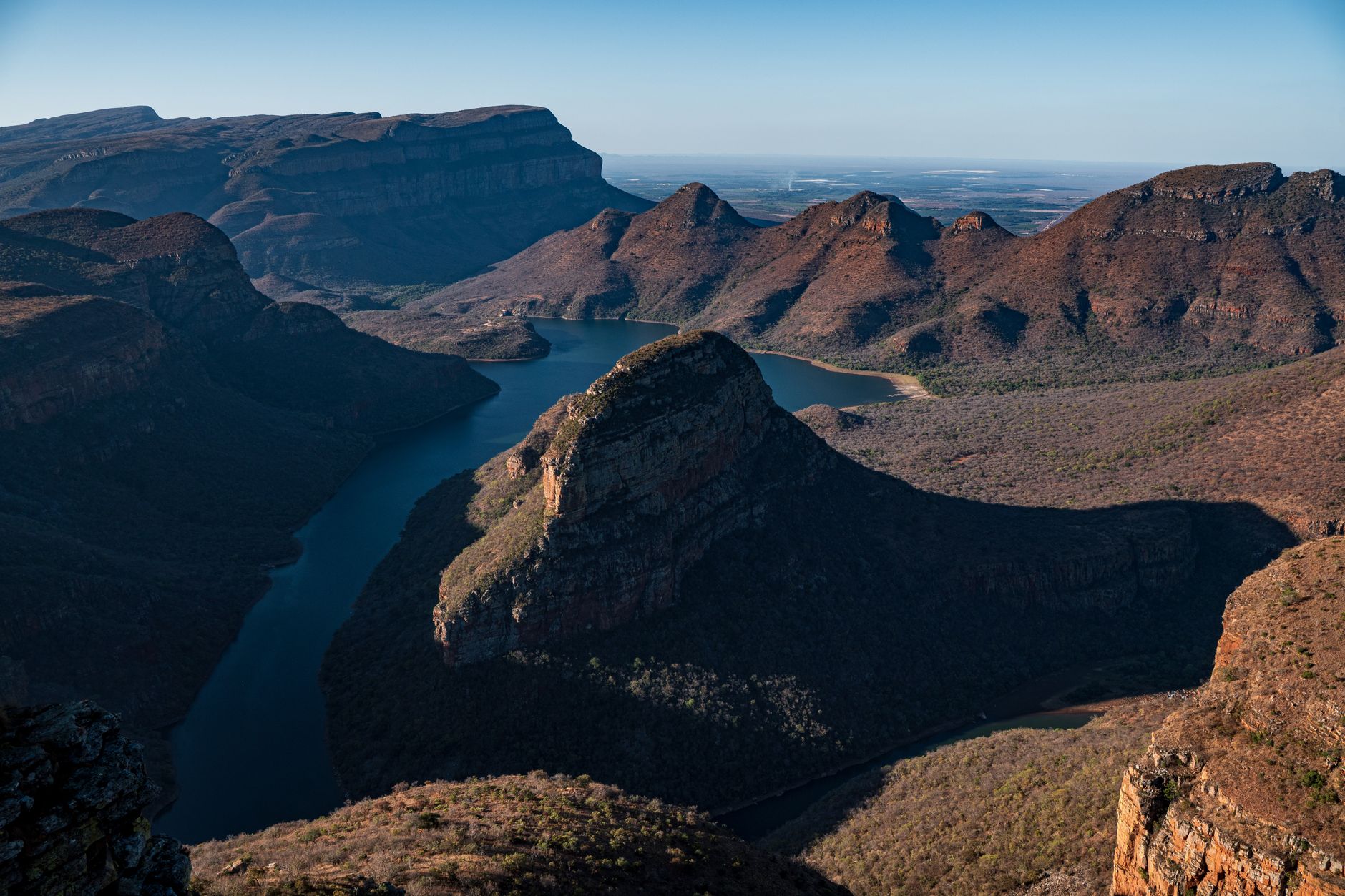 Deep river gorge with forested canyon walls and a winding river below