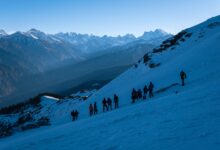 A narrow trekking trail winding through high-altitude Himalayan mountain terrain in Nepal