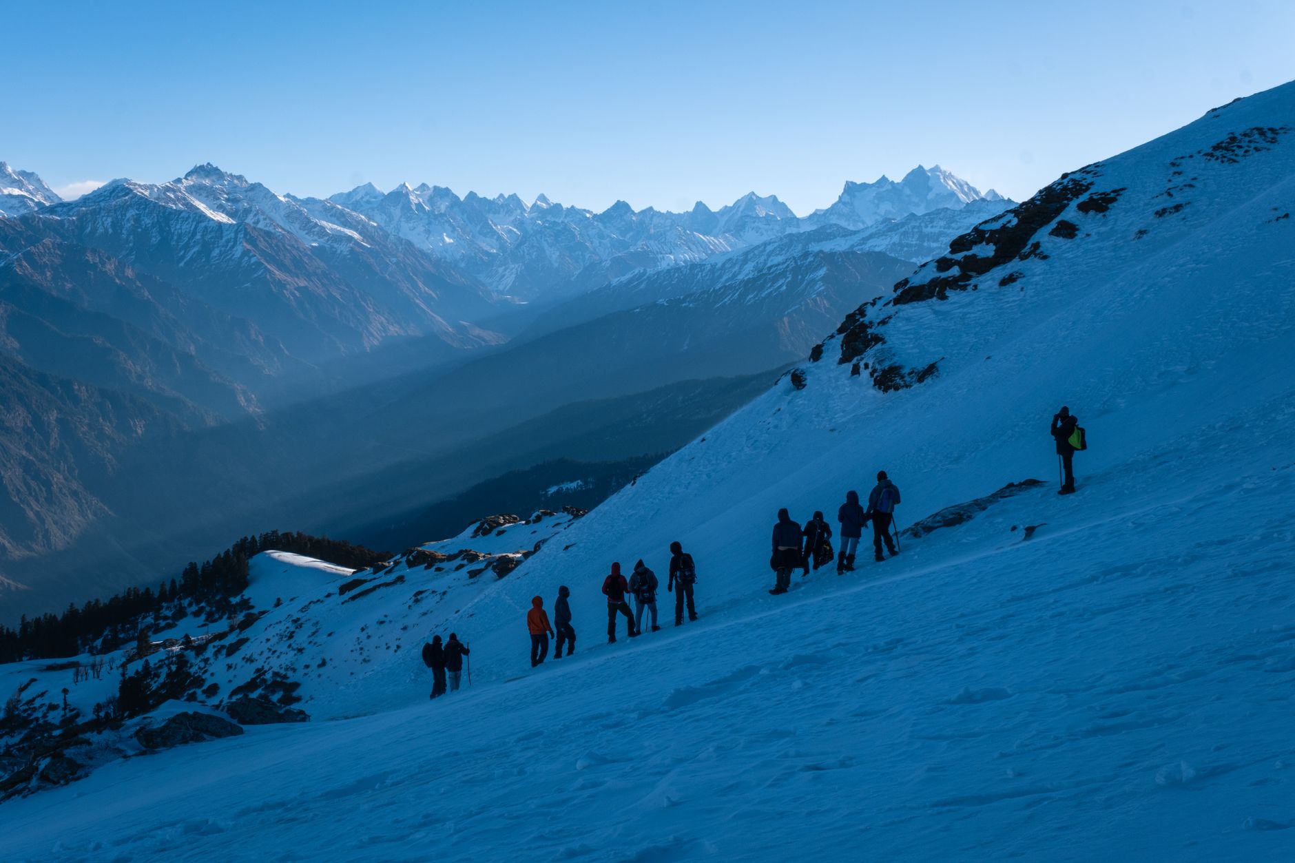 A narrow trekking trail winding through high-altitude Himalayan mountain terrain in Nepal