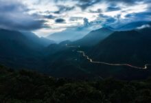 Winding mountain road through karst limestone landscape in northern Vietnam