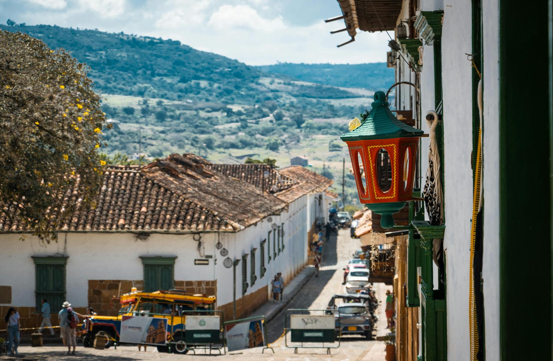 Colorful colonial architecture lining a narrow street in a small Colombian coffee town