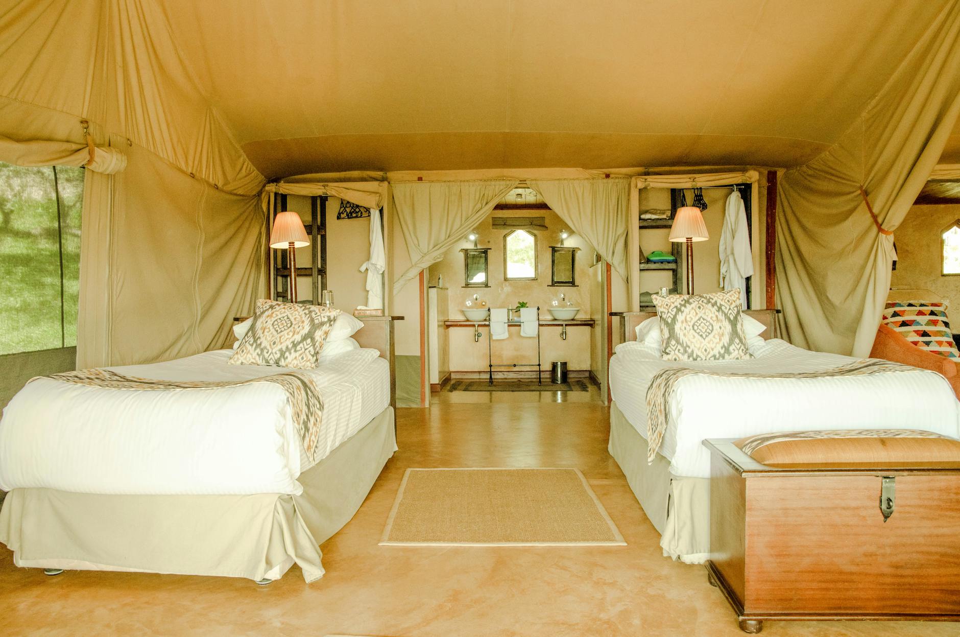 Luxury tented safari camp set against an African bush landscape