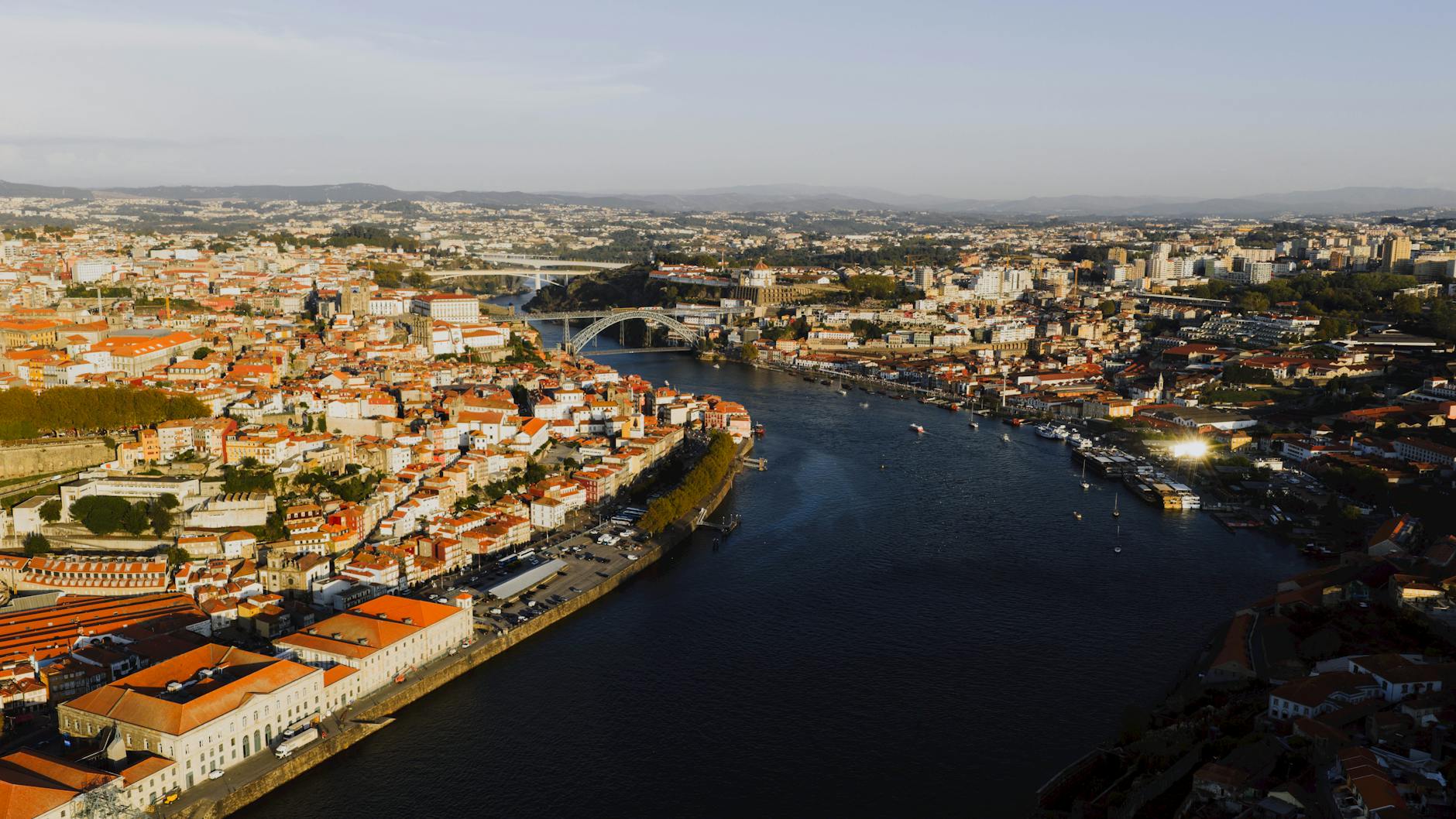 Panoramic view of the Douro River winding through terraced hillsides at dusk