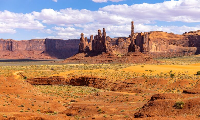 A remote high-altitude desert valley with dry mountains and a winding river below