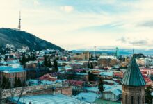Aerial view of Tbilisi old town with traditional balconied buildings and sulfur bath domes
