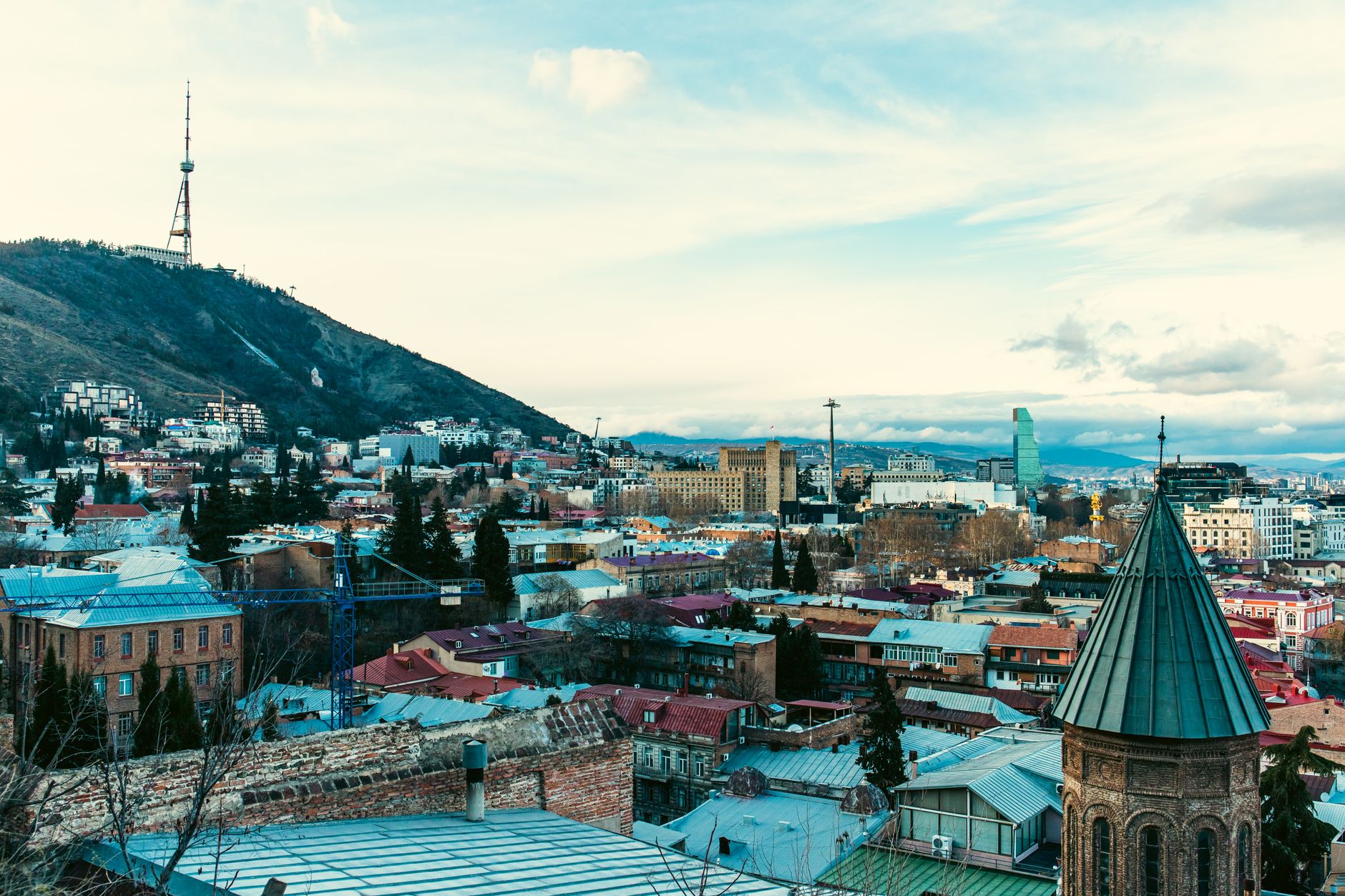 Aerial view of Tbilisi old town with traditional balconied buildings and sulfur bath domes