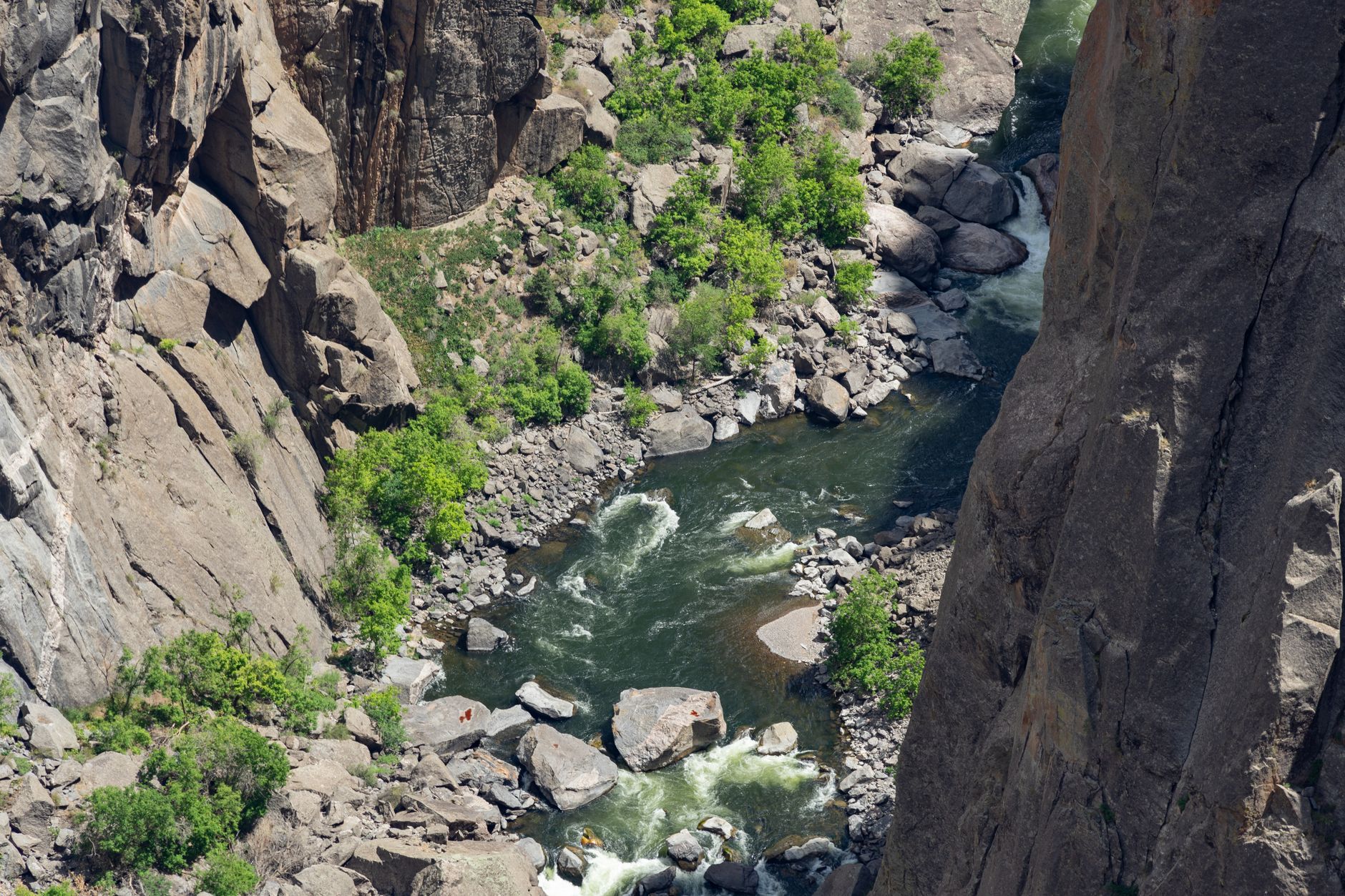 Aerial view of a winding river canyon cutting through limestone hills