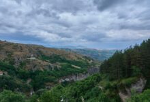 Ancient Armenian monastery surrounded by dense green forest in northern Armenia