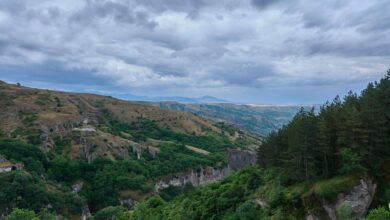 Ancient Armenian monastery surrounded by dense green forest in northern Armenia