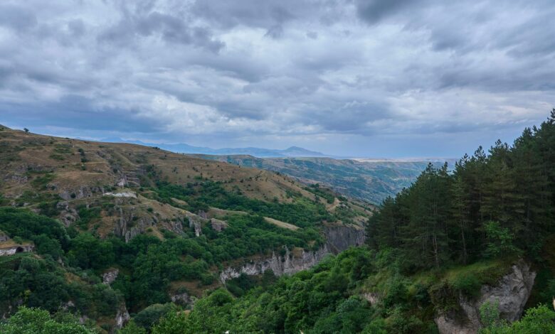 Ancient Armenian monastery surrounded by dense green forest in northern Armenia