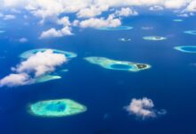 Aerial view of tropical islands surrounded by turquoise Andaman Sea water