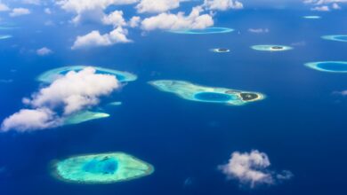 Aerial view of tropical islands surrounded by turquoise Andaman Sea water