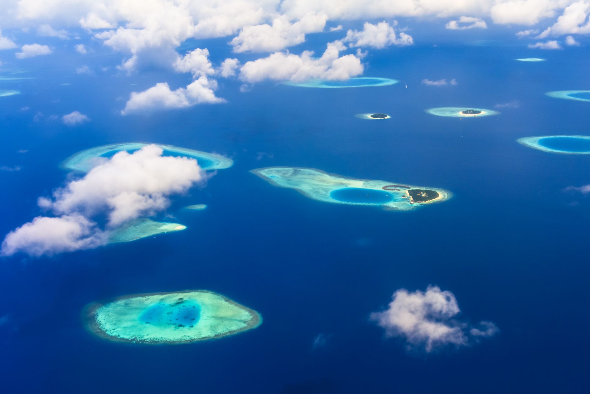 Aerial view of tropical islands surrounded by turquoise Andaman Sea water