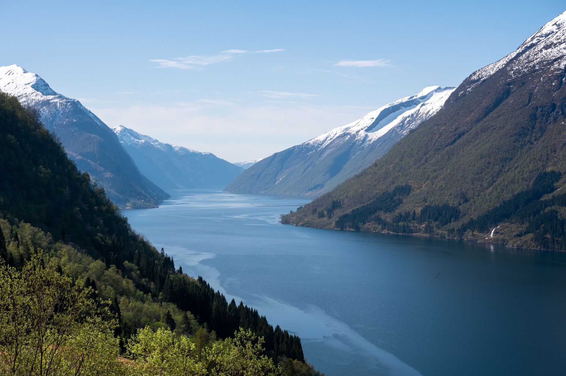 Narrow tropical fjord inlet surrounded by dense jungle in Papua New Guinea