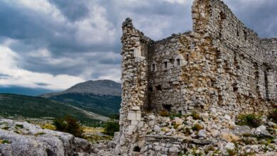 Ancient stone fortress ruins perched on a rocky mountain ridge in northern Iran