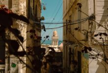 Whitewashed alleyway with blue doors in a North African medina
