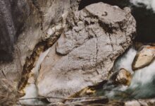 Narrow limestone canyon with a fast-flowing river cutting through tall rock walls