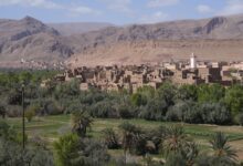 Ancient mud-brick kasbah fortress rising against a desert sky in Morocco's Draa Valley