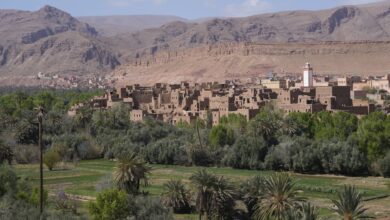 Ancient mud-brick kasbah fortress rising against a desert sky in Morocco's Draa Valley