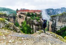 Stone medieval monastery built into a rocky canyon wall in Armenia
