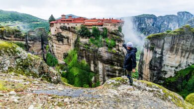 Stone medieval monastery built into a rocky canyon wall in Armenia