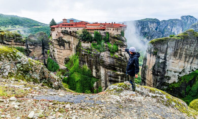 Stone medieval monastery built into a rocky canyon wall in Armenia