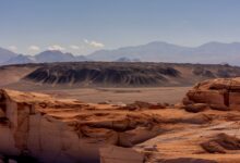 Star-filled night sky above the arid Atacama Desert landscape in Chile
