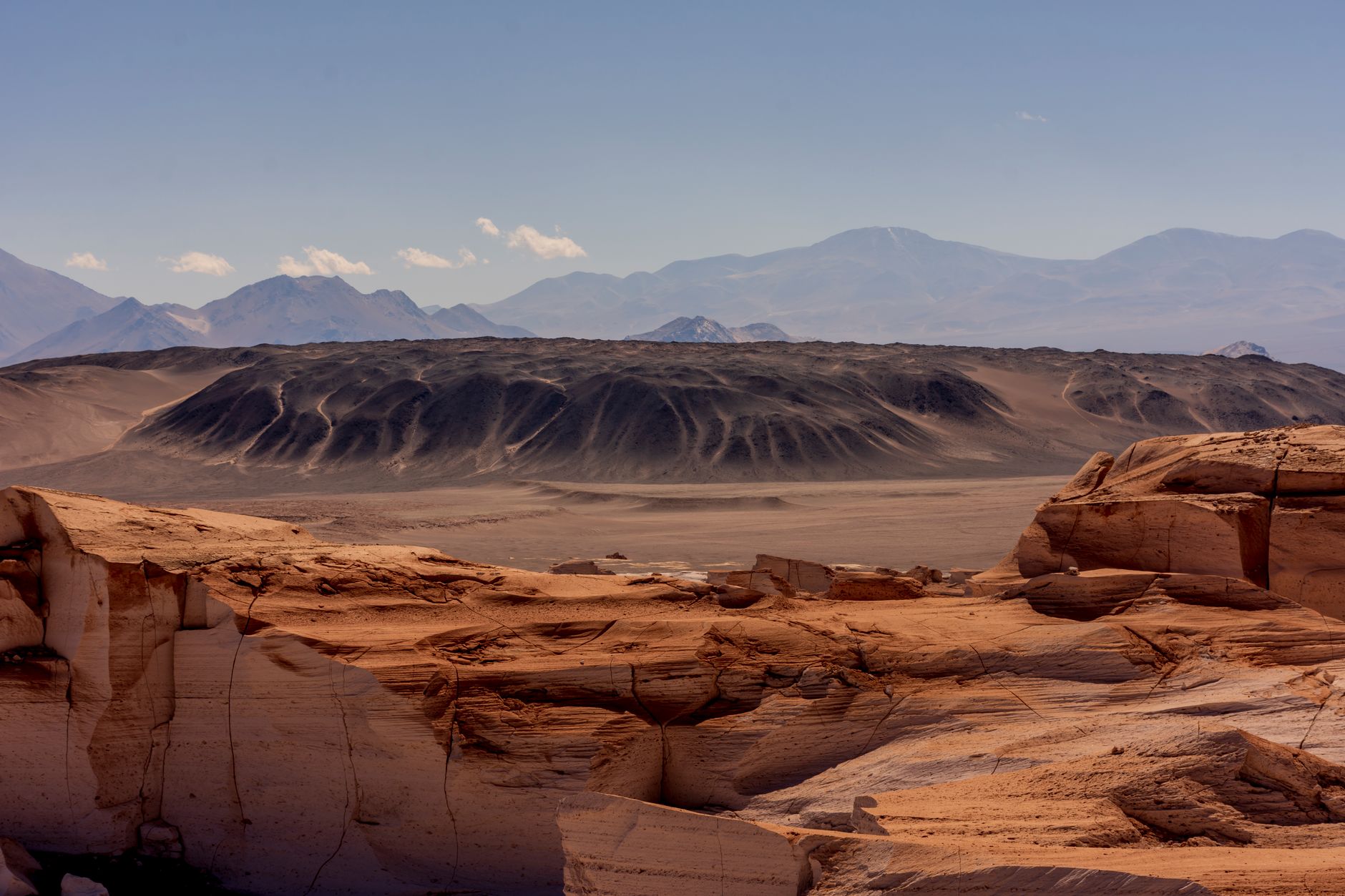 Star-filled night sky above the arid Atacama Desert landscape in Chile