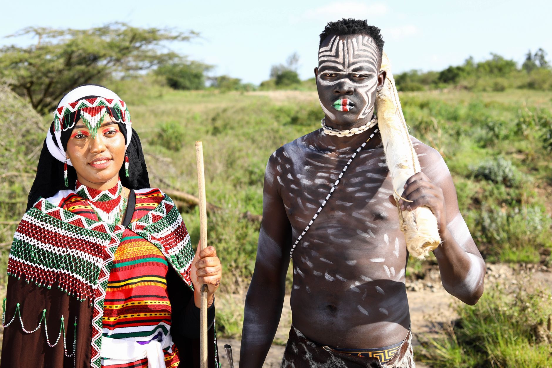 Close-up of traditional African body painting with ochre and white chalk patterns on skin