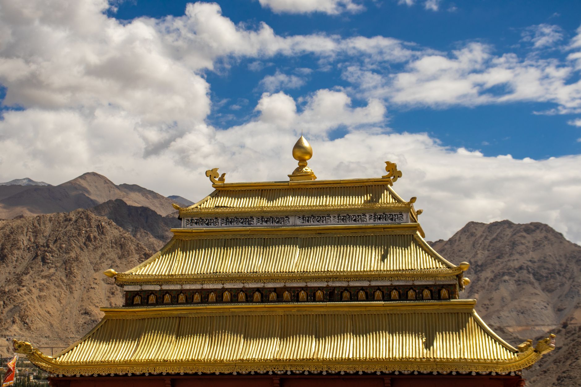Ancient Buddhist monastery interior with colorful murals and traditional Tibetan decor