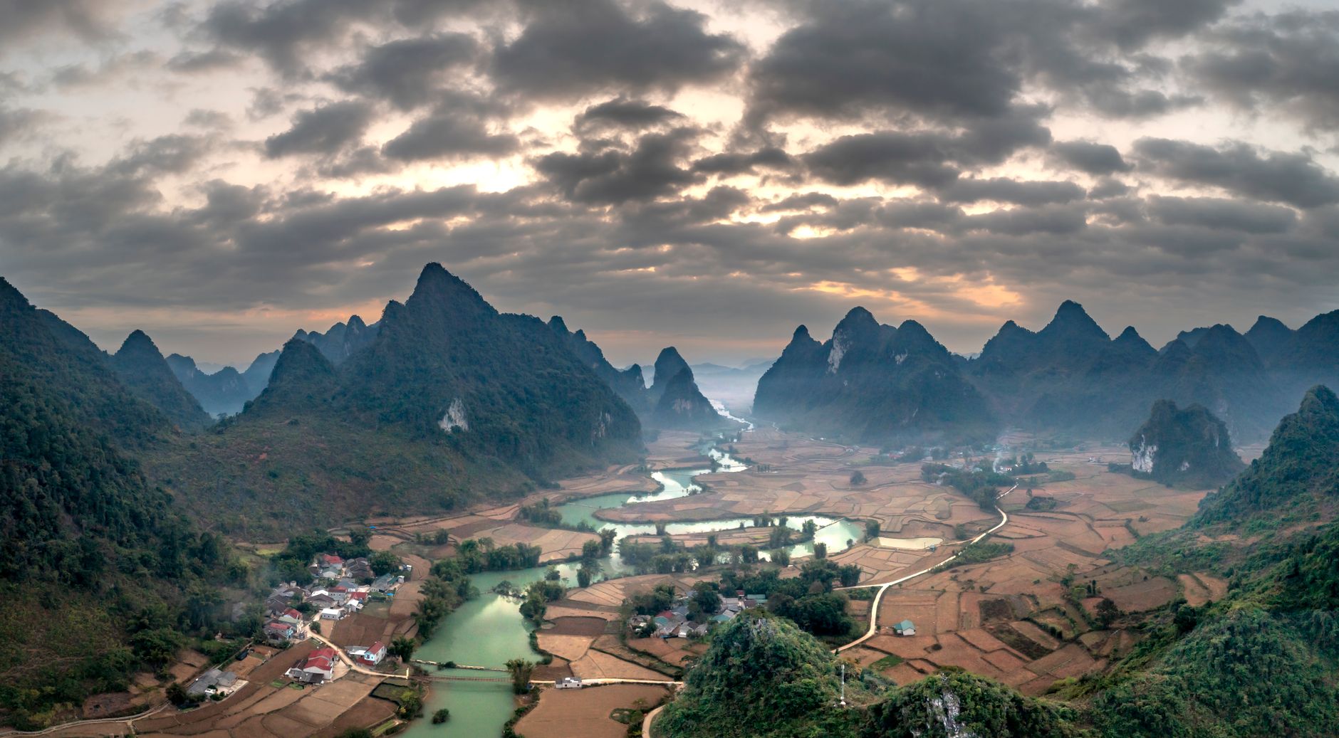Aerial view of deep river gorge cutting through karst plateau in Ha Giang province